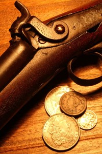 512px-Antique_Gun_and_Coins